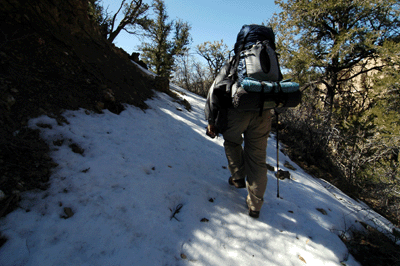 Hiking through snow below Big Saddle Point